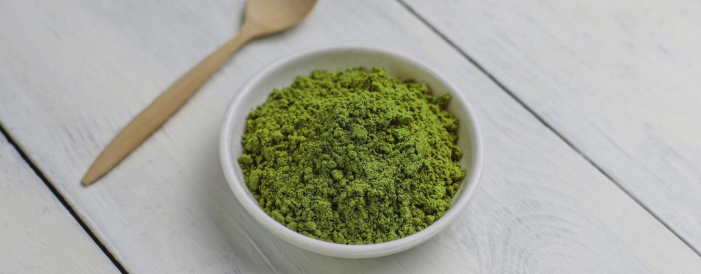 Word matcha made of powdered matcha green tea and bamboo spoon o